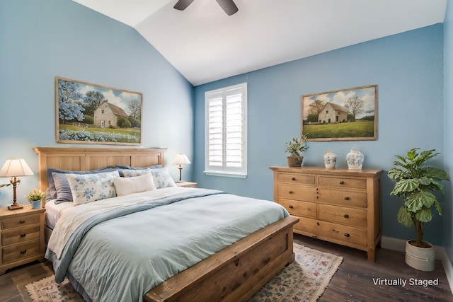 bedroom featuring lofted ceiling, dark hardwood / wood-style floors, and ceiling fan