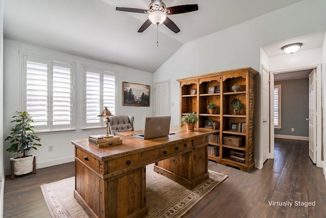 office area featuring vaulted ceiling, dark wood-type flooring, and ceiling fan