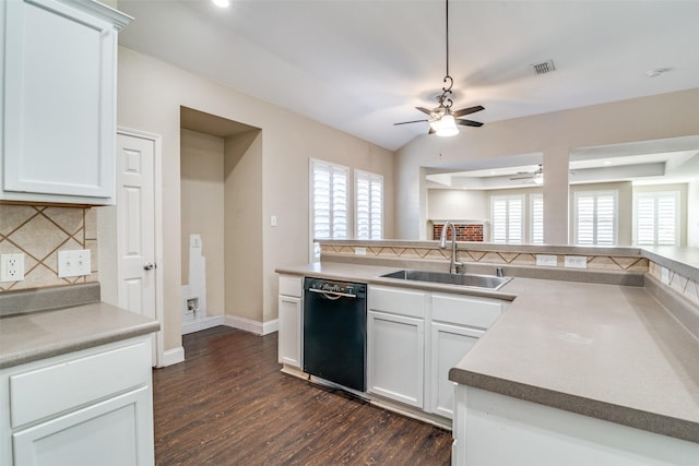 kitchen featuring sink, dark wood-type flooring, black dishwasher, white cabinets, and vaulted ceiling