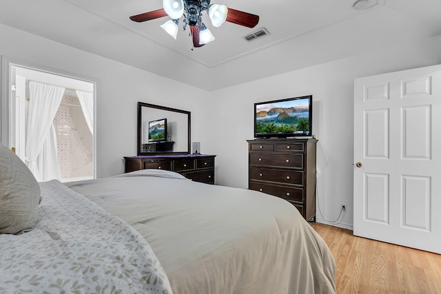 bedroom with ceiling fan and light hardwood / wood-style floors