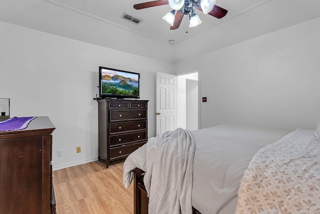 bedroom with light hardwood / wood-style flooring and ceiling fan