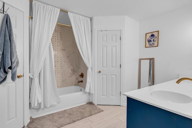 bathroom with shower / tub combo with curtain, vanity, and hardwood / wood-style floors