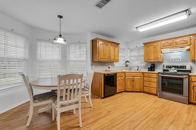 kitchen featuring hanging light fixtures, stainless steel electric range oven, black dishwasher, and light hardwood / wood-style flooring