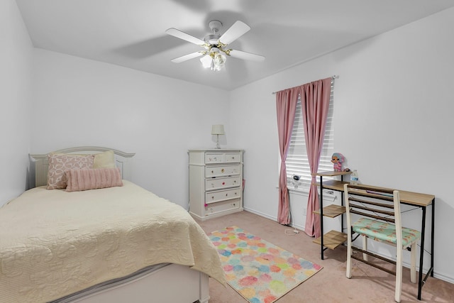 bedroom featuring ceiling fan and light carpet