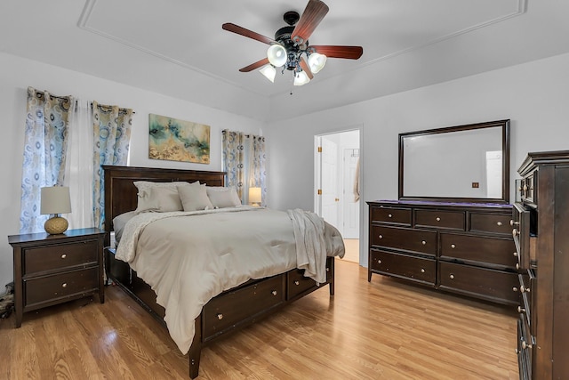 bedroom with ceiling fan and light wood-type flooring