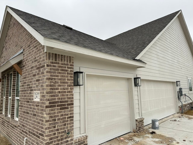 view of side of home with a garage