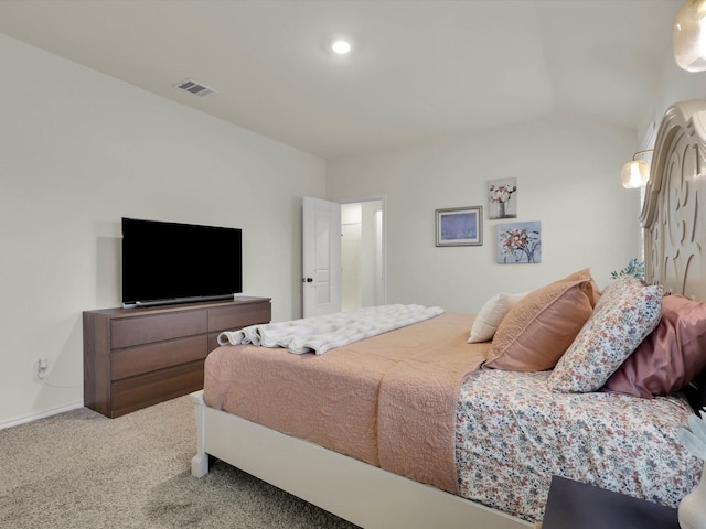 bedroom with lofted ceiling and carpet