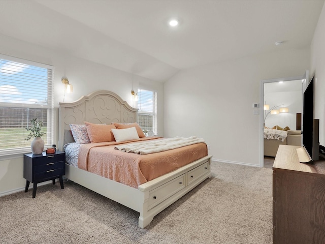 carpeted bedroom featuring lofted ceiling