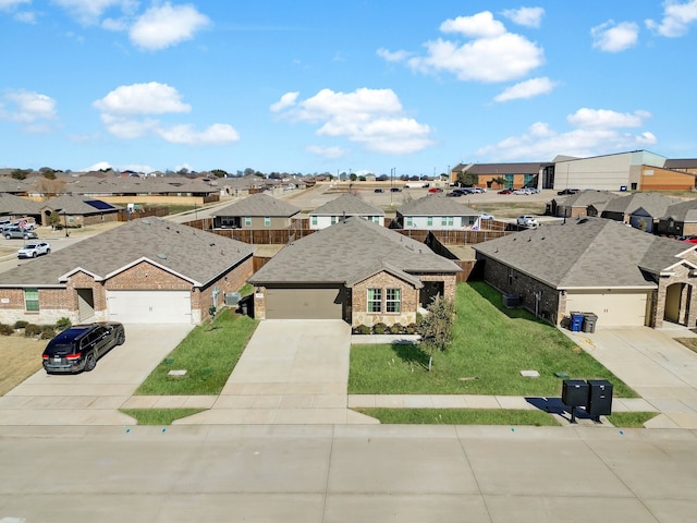 view of front of property with a garage and a front lawn