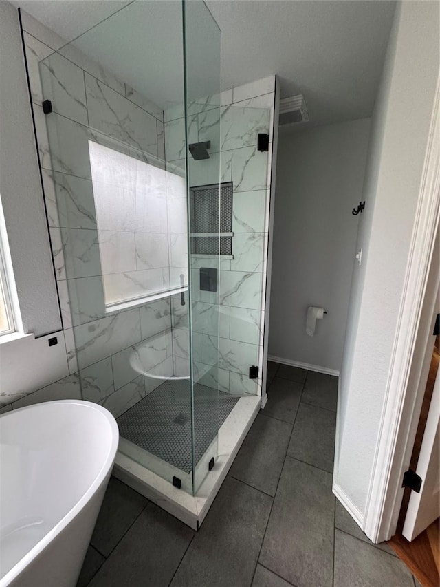 bathroom with independent shower and bath