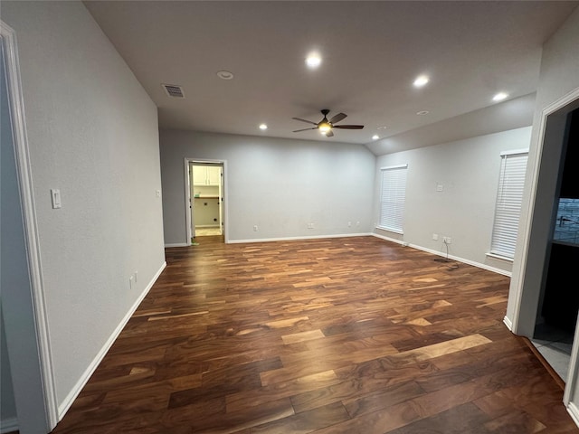 empty room featuring dark hardwood / wood-style flooring and ceiling fan