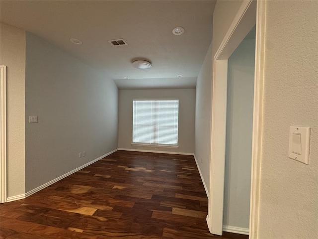 hallway featuring dark hardwood / wood-style floors