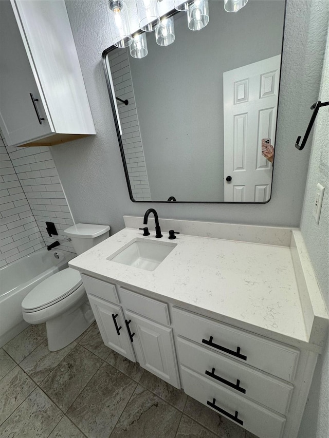 full bathroom with vanity, toilet, and  shower combination