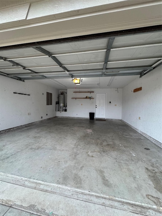 garage with a garage door opener, electric panel, and water heater