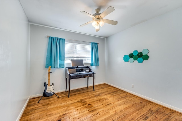 miscellaneous room with ceiling fan and light wood-type flooring