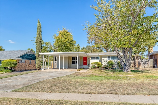 single story home with a front yard and a carport