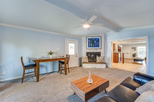 living room with crown molding, light colored carpet, a fireplace, and vaulted ceiling with beams