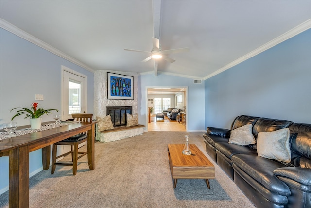 carpeted living room featuring ornamental molding, lofted ceiling, and a large fireplace