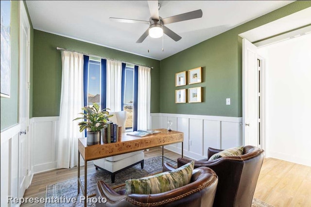 office space with ceiling fan and light hardwood / wood-style flooring