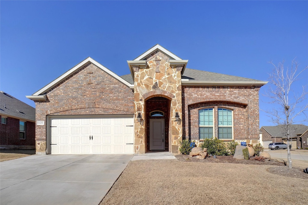 view of front of home with a garage