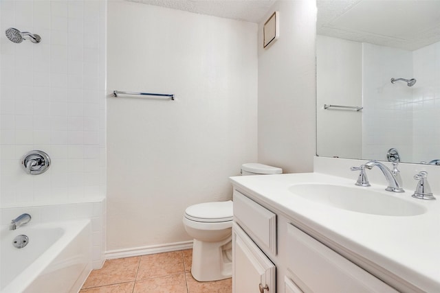 full bathroom with tiled shower / bath combo, vanity, toilet, tile patterned floors, and a textured ceiling