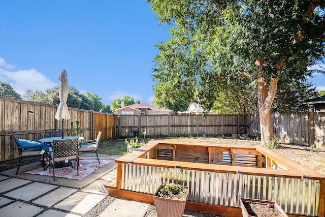 wooden deck with a patio