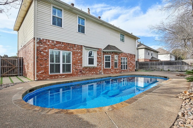 view of pool with a patio, a fenced backyard, and a fenced in pool