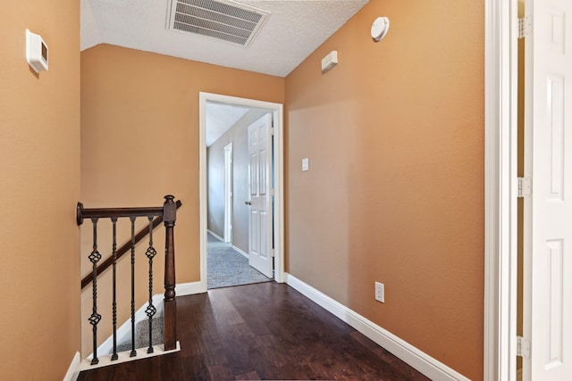 hallway with hardwood / wood-style flooring