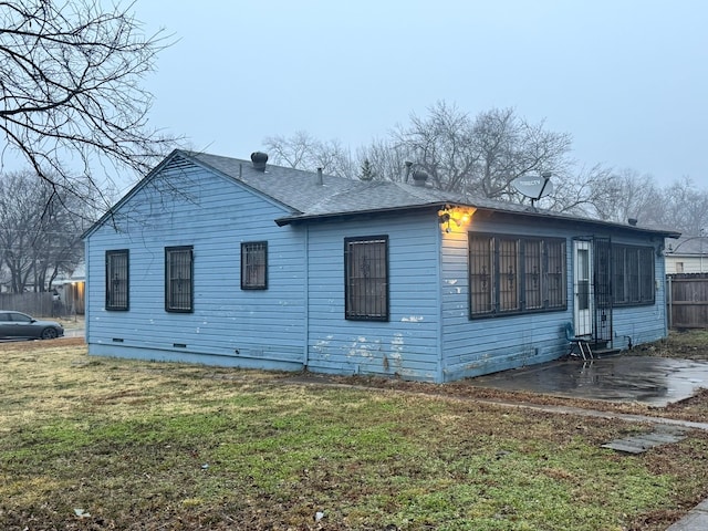 view of home's exterior featuring a yard and a patio