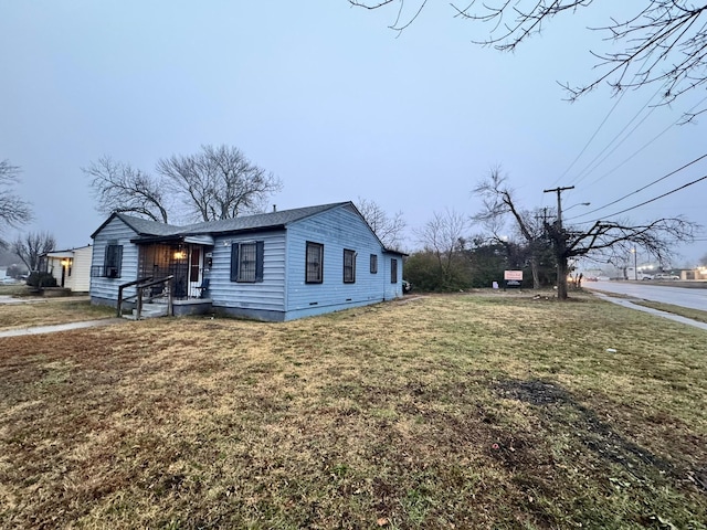 view of home's exterior featuring a yard