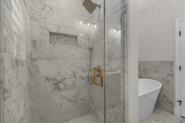 bathroom featuring independent shower and bath and tile walls