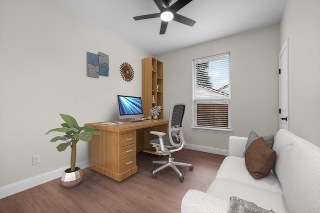 home office with wood-type flooring and ceiling fan