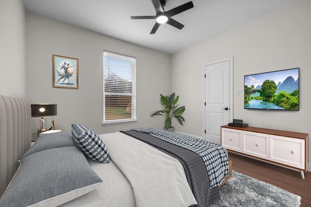 bedroom with ceiling fan and dark hardwood / wood-style floors