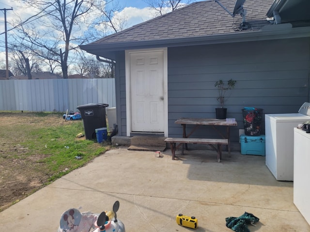 view of outbuilding featuring fence