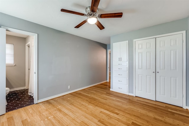 unfurnished bedroom with ceiling fan, a closet, and light hardwood / wood-style flooring