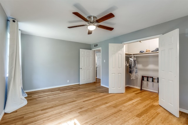 unfurnished bedroom featuring a closet, ceiling fan, and light wood-type flooring