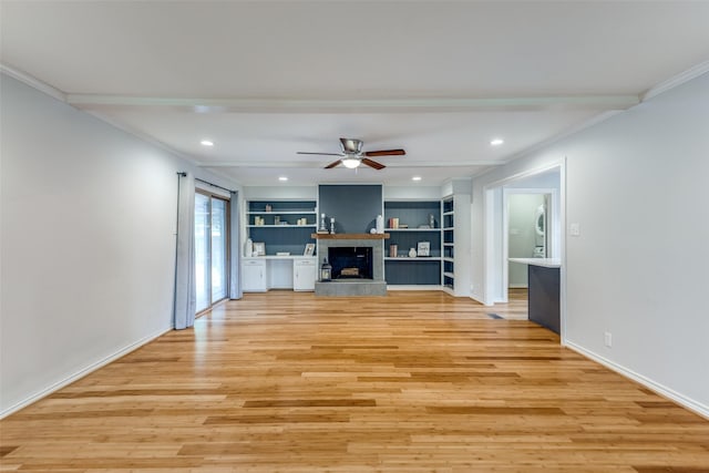 unfurnished living room featuring built in shelves, ornamental molding, light hardwood / wood-style floors, and ceiling fan