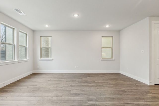 spare room featuring light hardwood / wood-style flooring