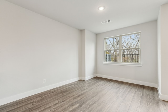 unfurnished room featuring light wood-type flooring