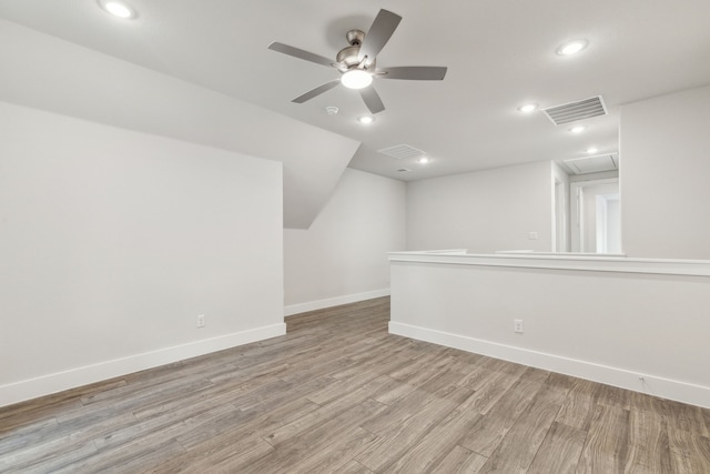 additional living space with vaulted ceiling, ceiling fan, and light hardwood / wood-style floors