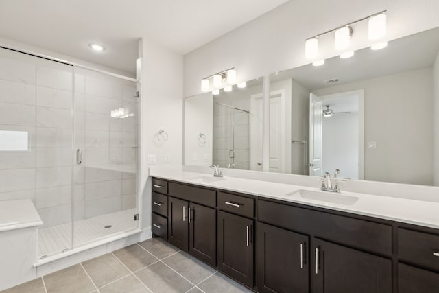 bathroom with vanity, tile patterned floors, ceiling fan, and walk in shower