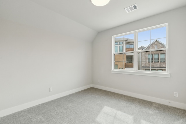 bonus room featuring carpet flooring and vaulted ceiling