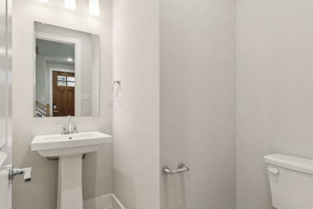 bathroom with sink and toilet