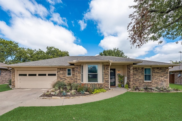 view of front of property with a garage and a front lawn