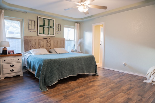 bedroom featuring dark wood-type flooring and ceiling fan