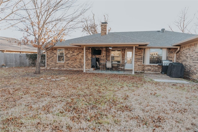 back of house with a patio area