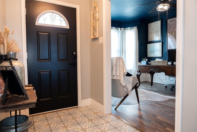 foyer with ceiling fan and light hardwood / wood-style floors