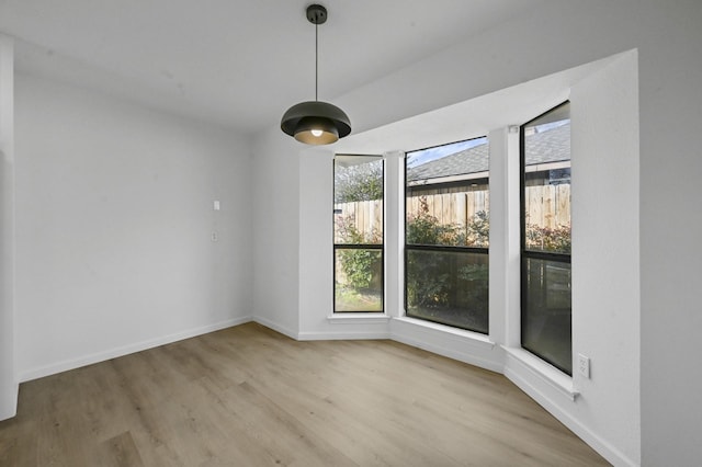 unfurnished dining area with light hardwood / wood-style flooring