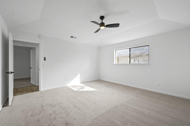 carpeted spare room with lofted ceiling and ceiling fan