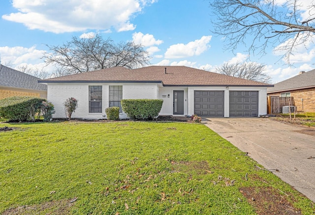 ranch-style house with a garage and a front yard